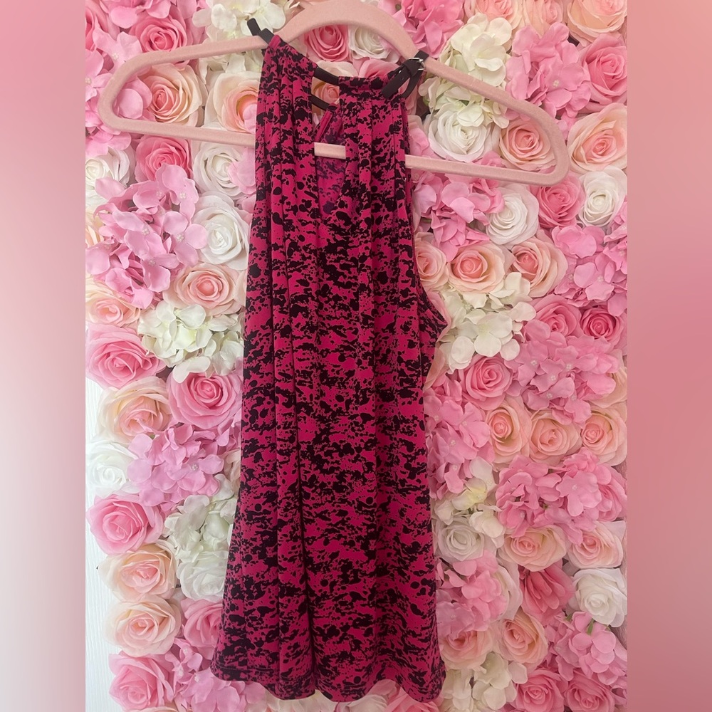 Michael Kors pink and black top with straps around the neck.